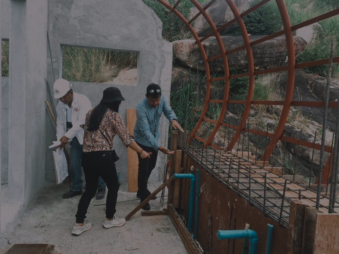 Architect Phuket Nay inspects a construction site in Koh Samui